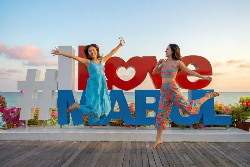 Famous photo spot at the I Love Mabul sign on Mabul Island Jelly Sea Resort