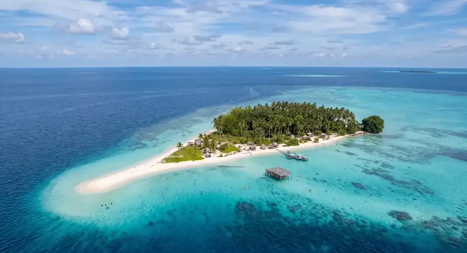 Pristine beach and clear water at Sibuan Island Jelly Sea Resort