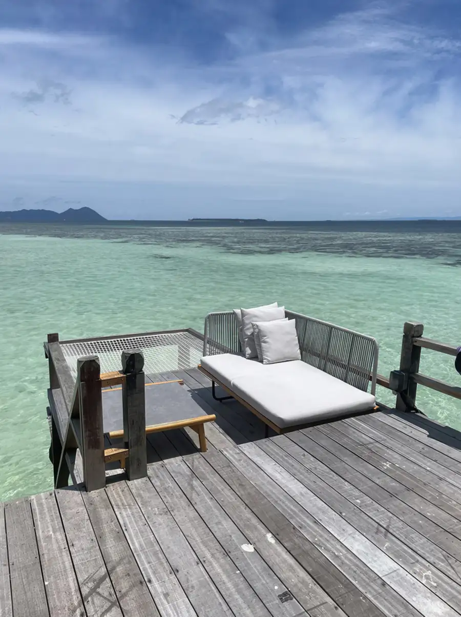 Relax on private wooden sea access stairs at Jelly Sea Resort. A beautiful Semporna water resort allowing guests to step directly into the clear waters of the Celebes Sea.